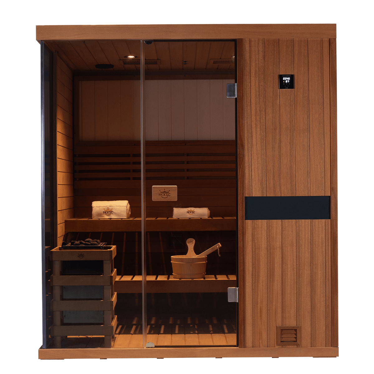 A modern wooden sauna cabin with glass doors, interior wooden benches, a digital control panel on the door, a hanging towel, a wooden bucket and brush, and a wood fire starter rack, shown on a clean white background.