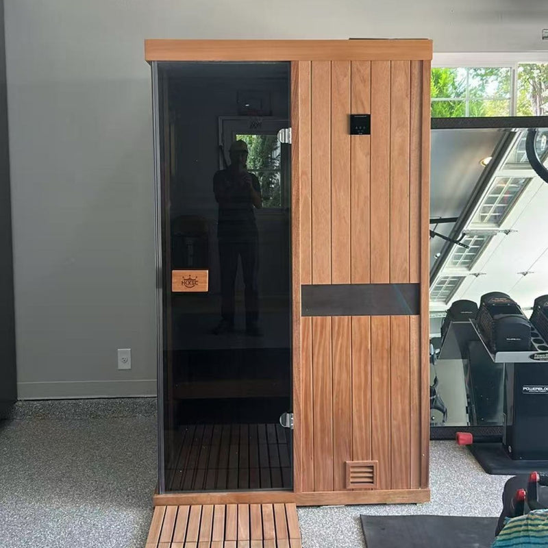 Garage-installable wooden steam sauna cabin requiring wall or roof steam exhaust system, breathable interior planks that avoid swelling under high humidity with regular air-drying maintenance